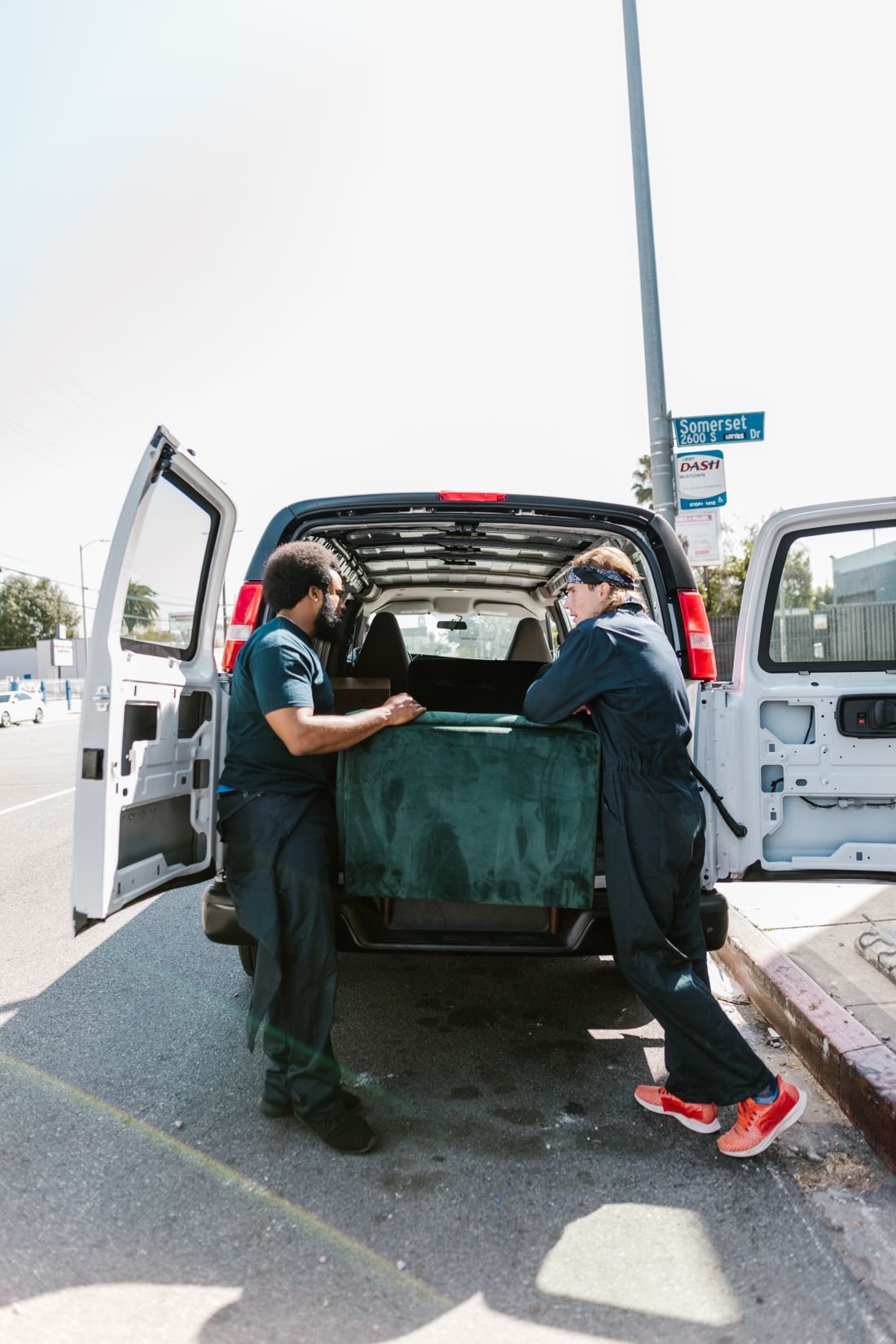 Junk removal crew loading furniture and clutter into a truck